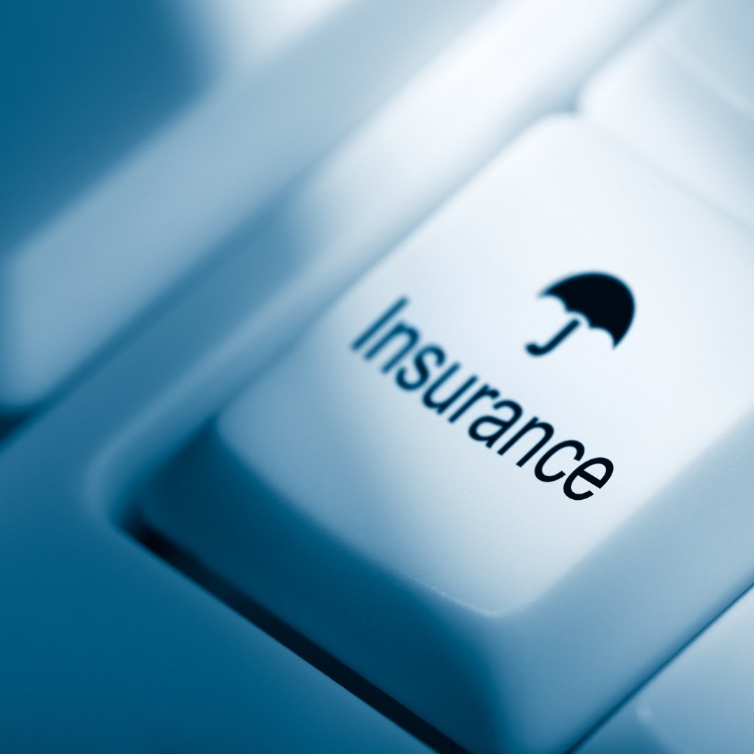 Keyboard key marked with an insurance umbrella symbol