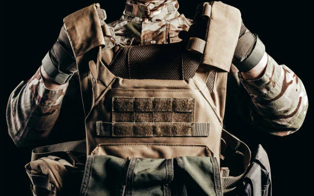 Operator wearing a tactical vest and protective body armour